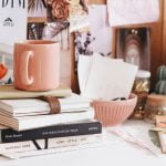 a table with books and a mug on it