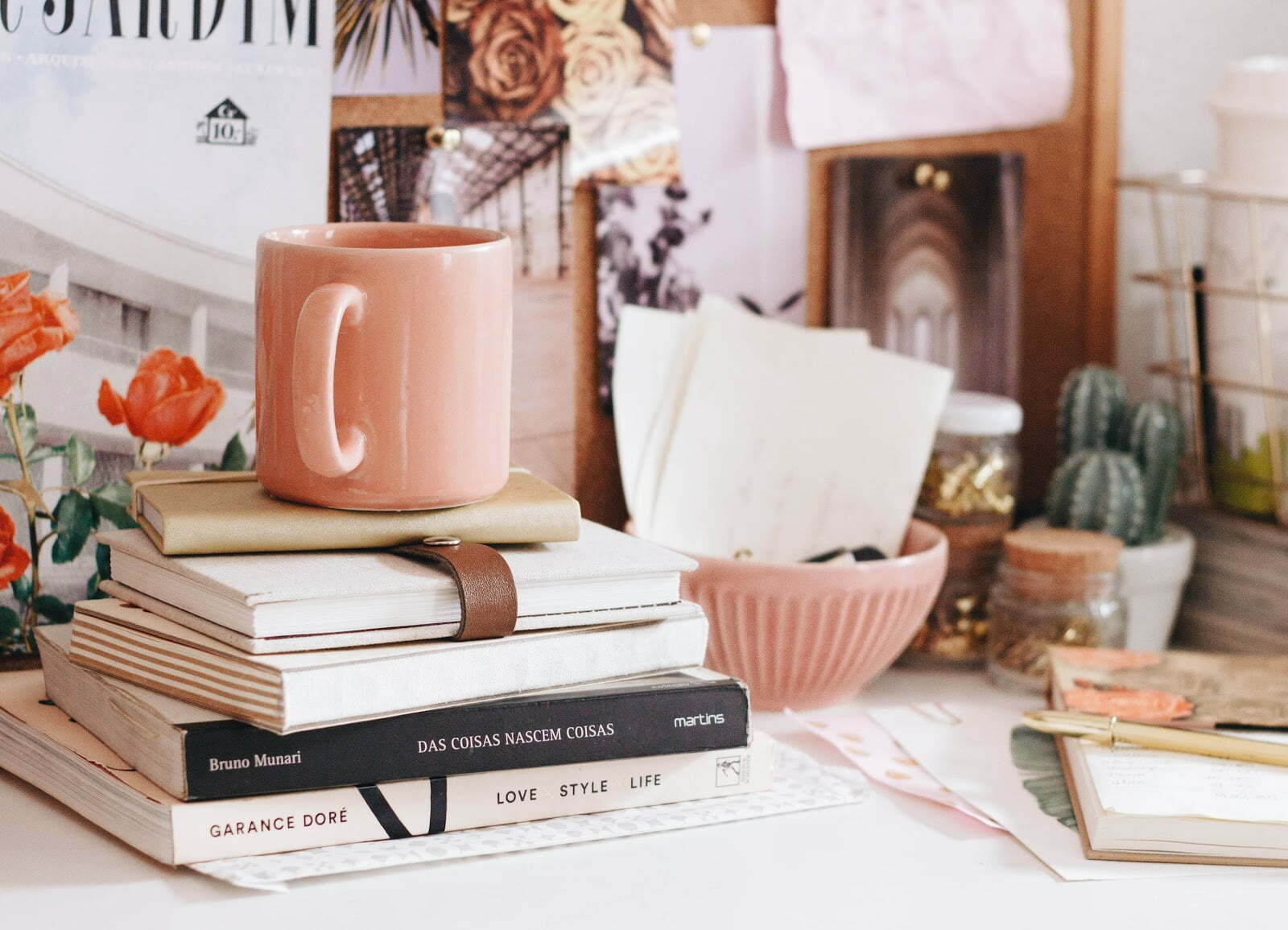 a table with books and a mug on it