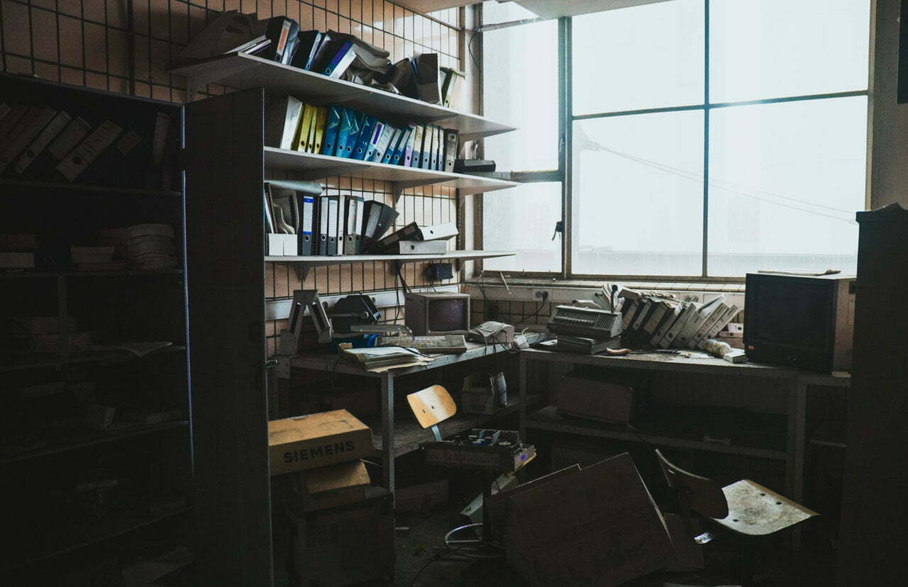 a room with shelves and a desk