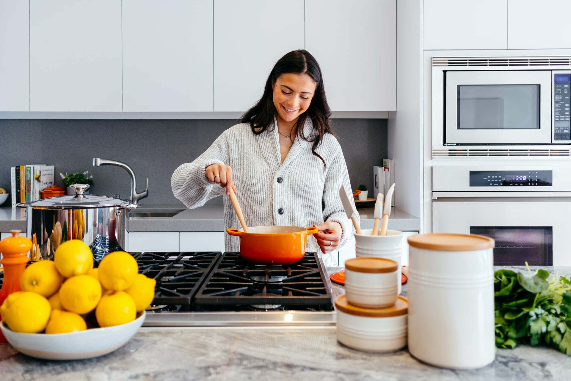 a woman cooking in a kitchen