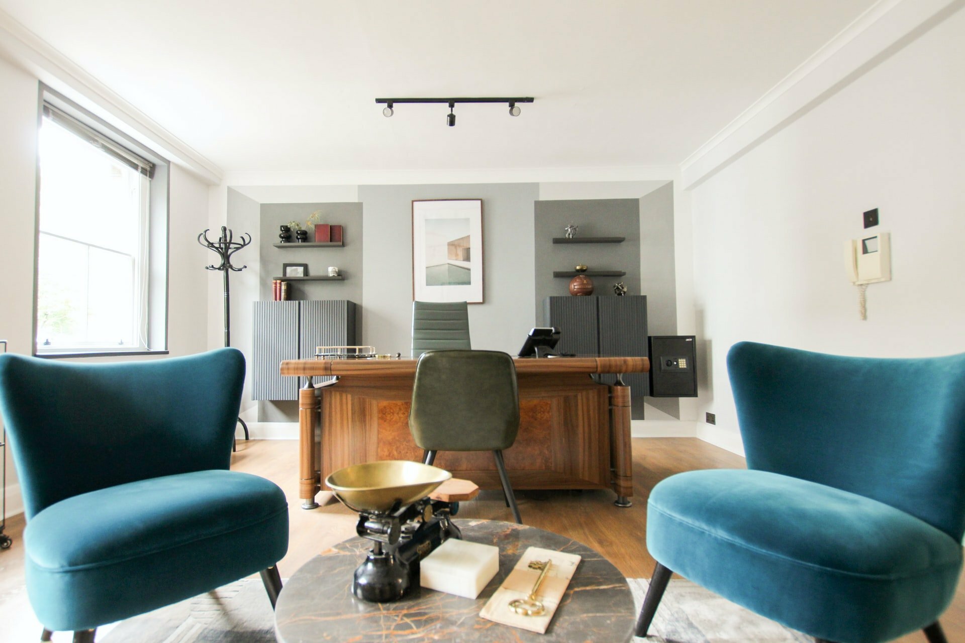 a living room with a desk and a tv