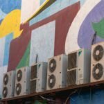 a large colorful wall with a large painting on it