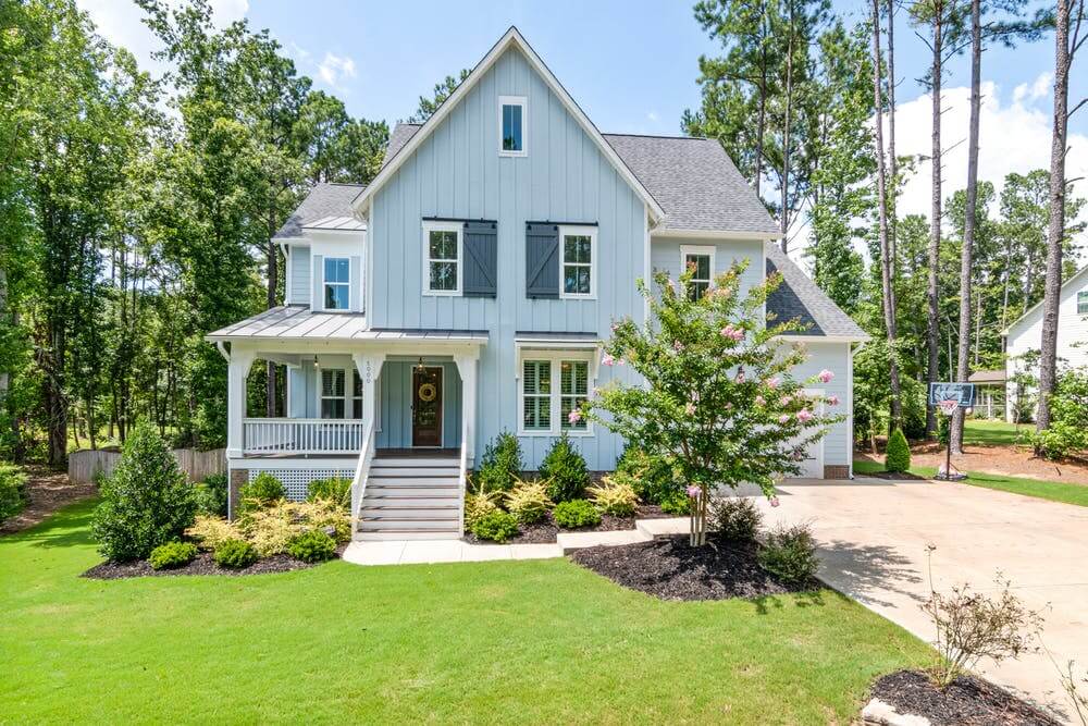 a house with a lawn and trees