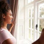 a woman looking out a window