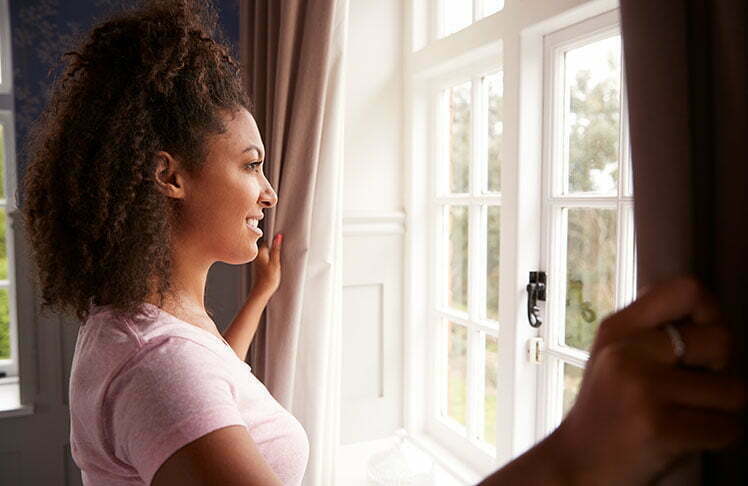 a woman looking out a window