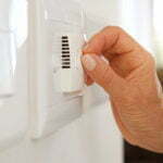 a close-up of a hand opening a door
