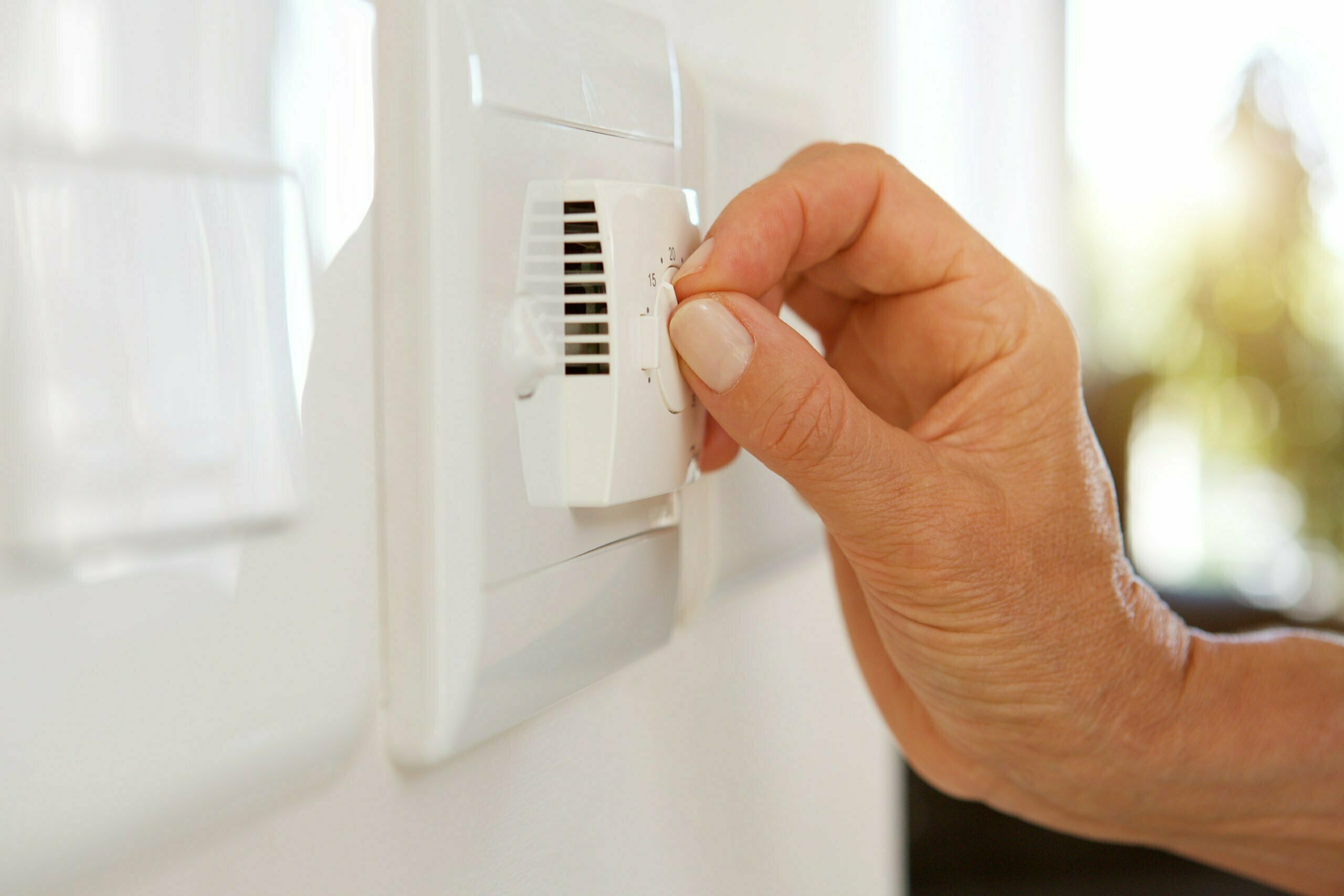 a close-up of a hand opening a door