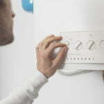 a man drawing on a white board