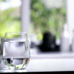 a glass of water on a table