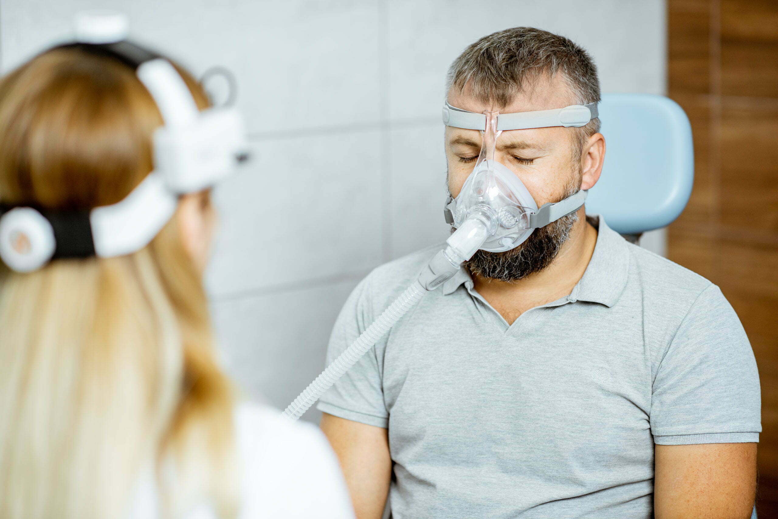 a man with a beard and a woman in a mask