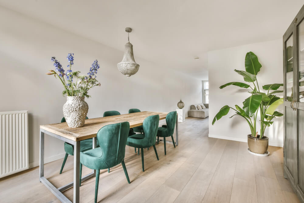 a dining room with a table and chairs